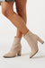 Blair Faux Leather Heeled Ankle Boots in Beige