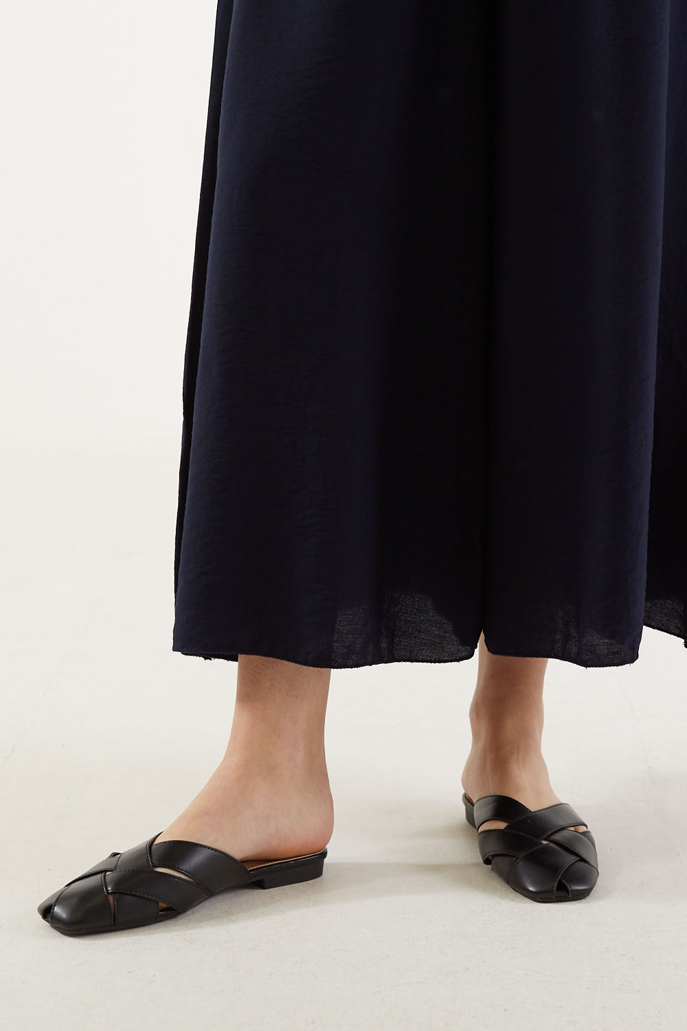 Lola Woven Flat Mules in Black