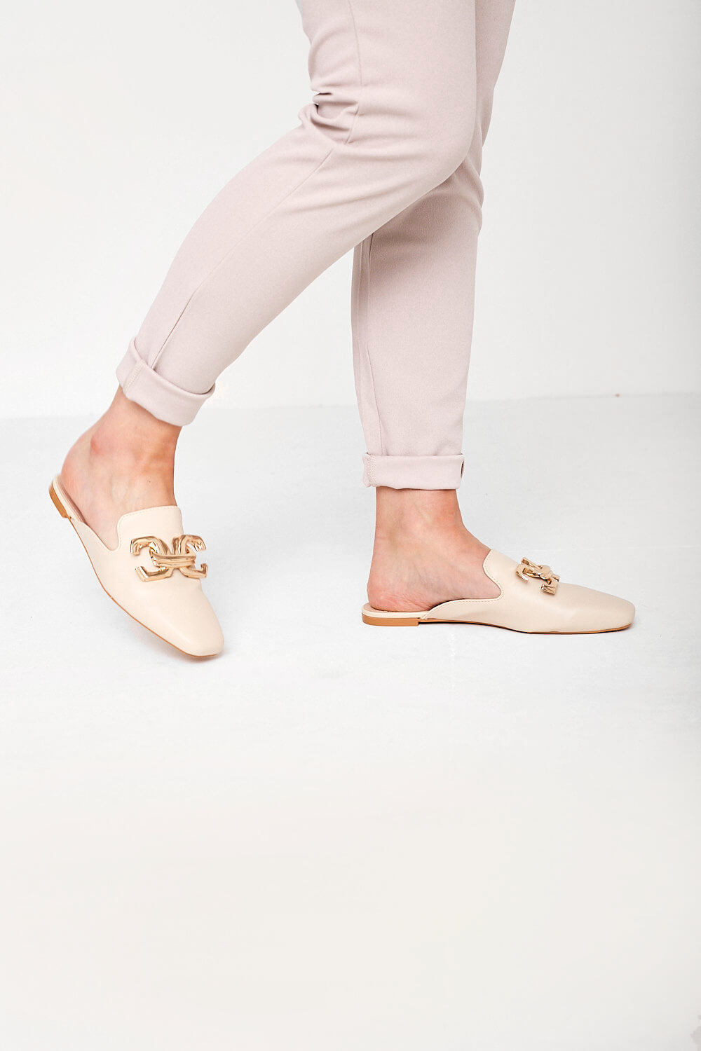 https://www.iclothing.com/media/catalog/product/d/e/delia_gold_buckle_mule_loafers_in_beige-1.jpg