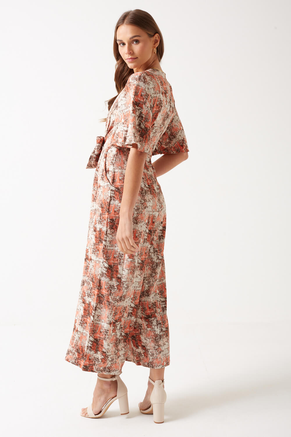 https://www.iclothing.com/media/catalog/product/k/a/kanika_printed_short_sleeve_jumpsuit_in_peach-3.jpg