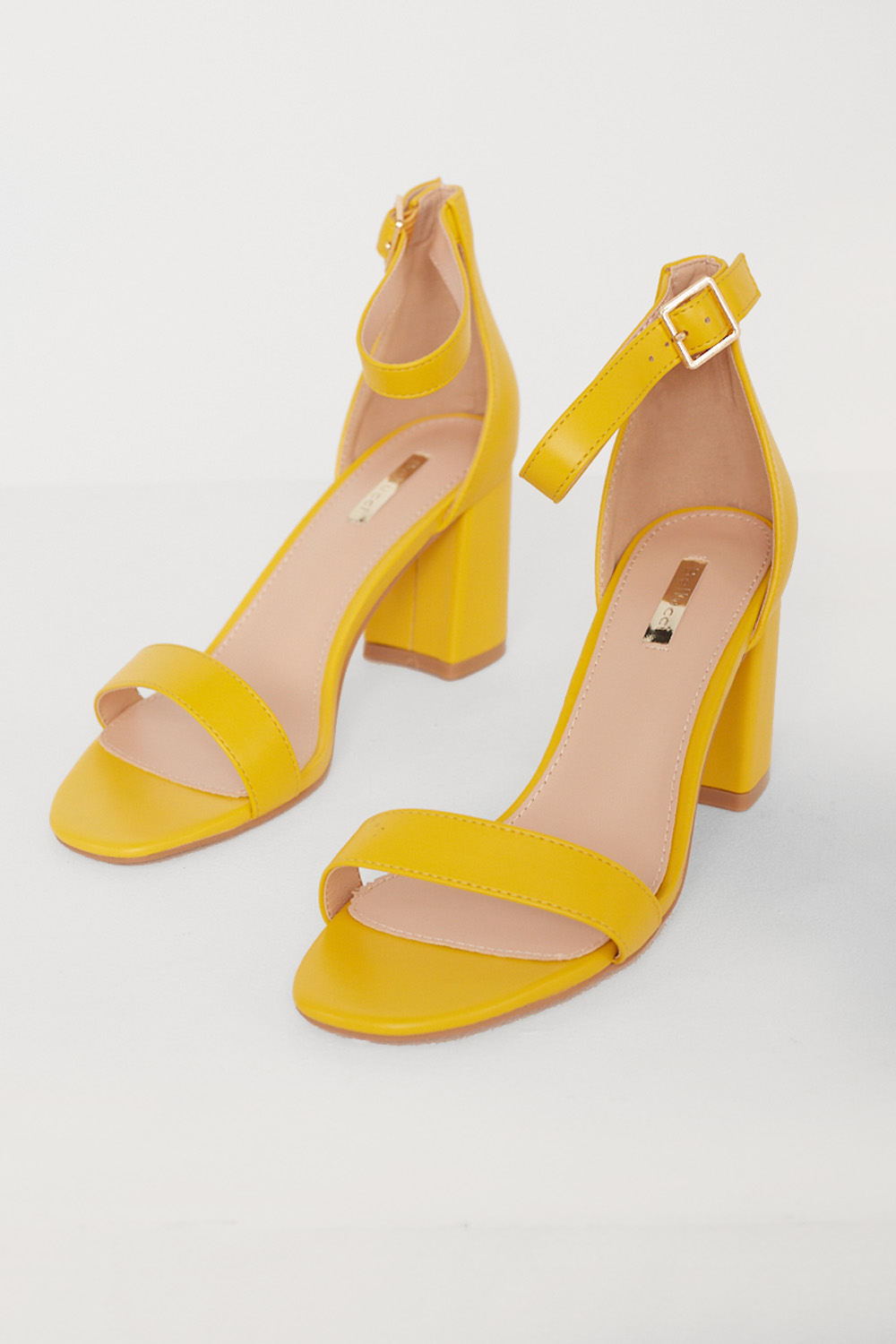 https://www.iclothing.com/media/catalog/product/l/i/lillee_faux_leather_heel_sandals_in_yellow-1.jpg